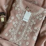 Rose gold pink cotton net festive suit with elegant handwork by Qurayaal