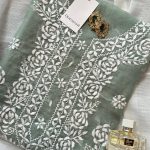 Turquoise hand embroidered outfit on cotton net