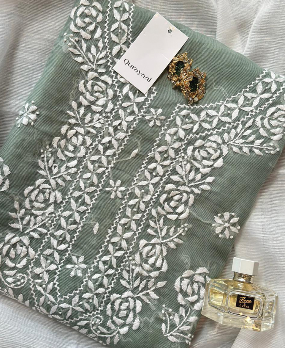 Turquoise hand embroidered outfit on cotton net