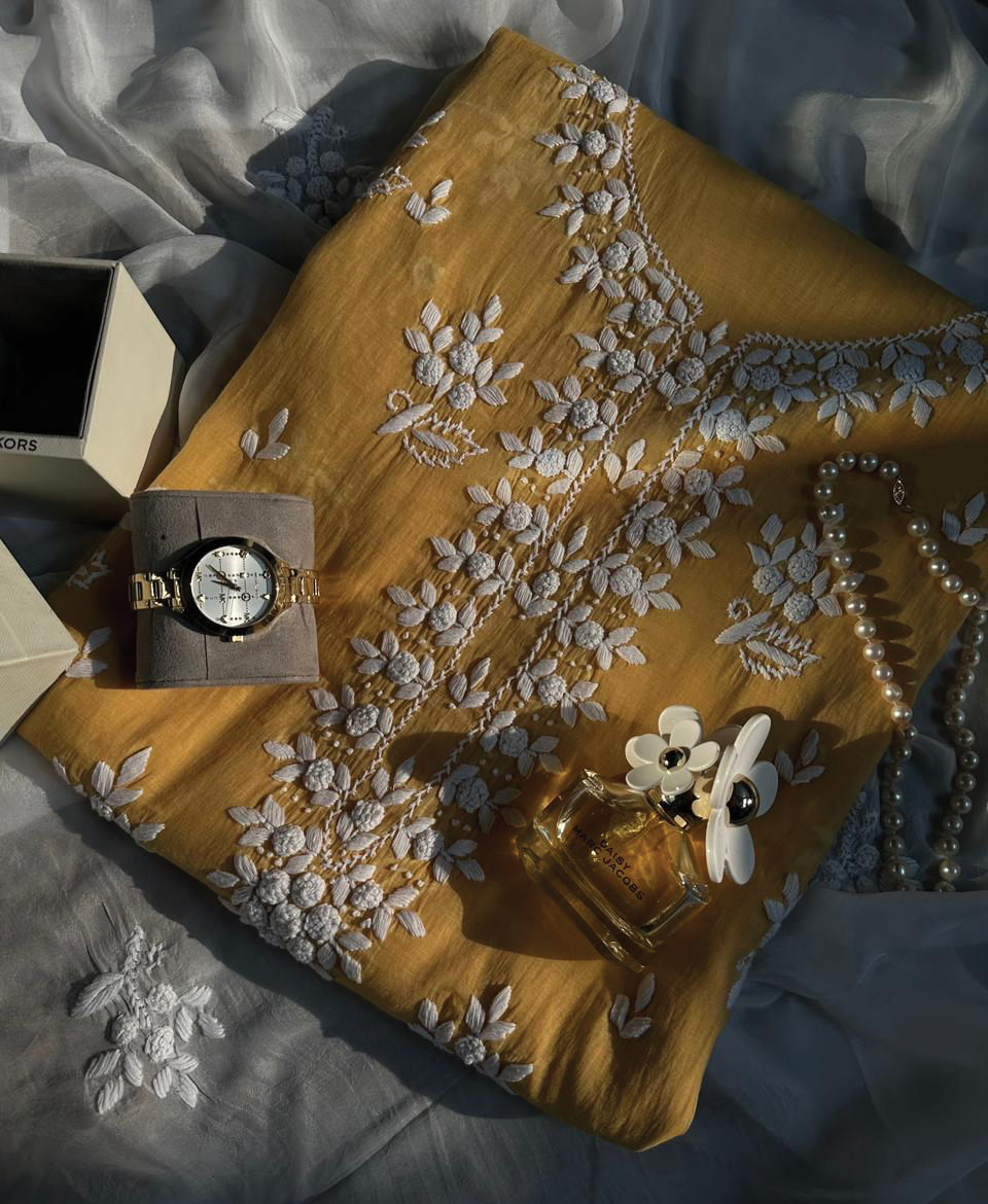 Butter yellow paper lawn embroidered suit with white hand embroidery by Qurayaal